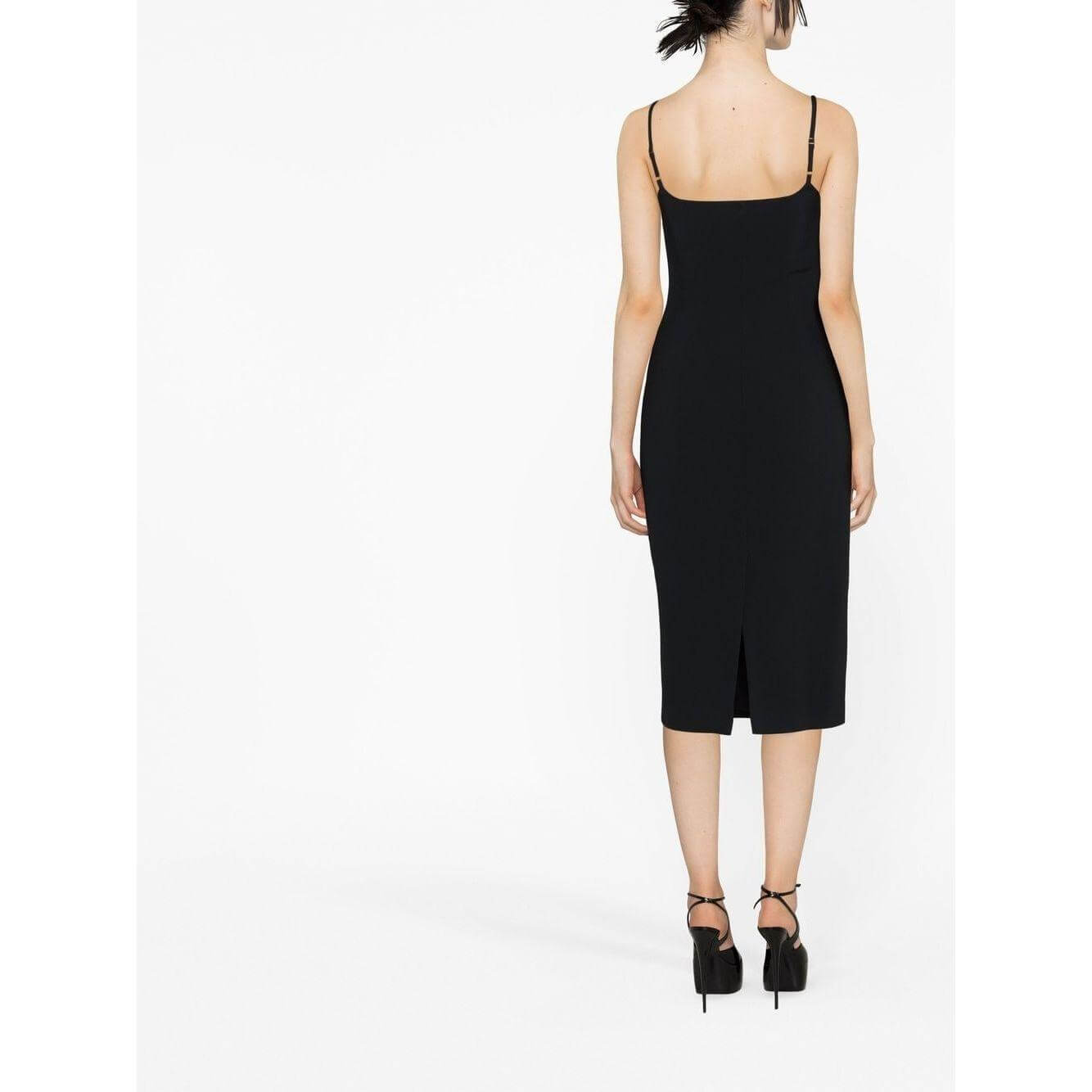 Back view of a black Blumarine heart sequin midi dress with spaghetti straps and central rear vent, worn by a model.