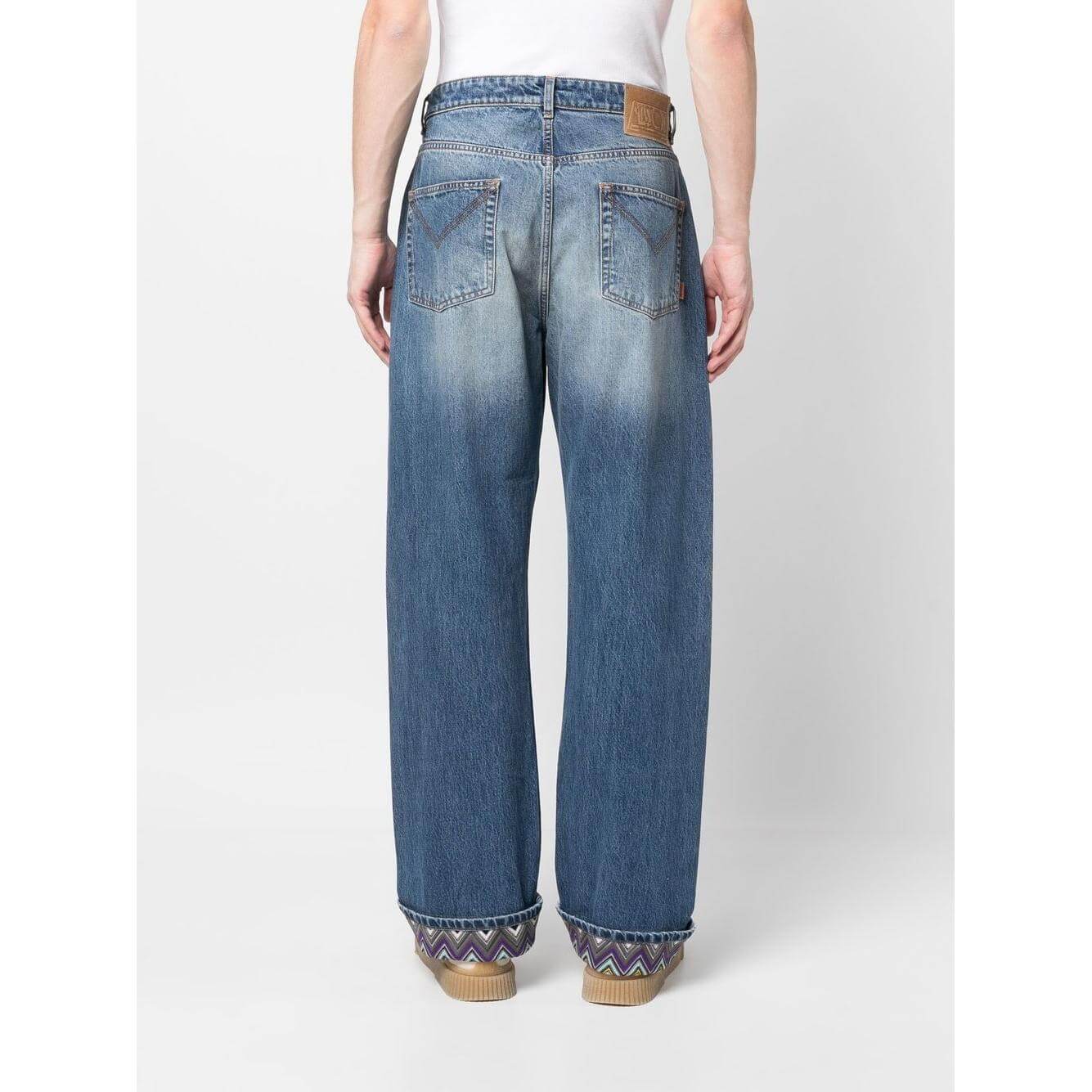 Back view of Missoni clear blue stonewashed denim jeans featuring zigzag design on cuffs and classic five-pocket style.