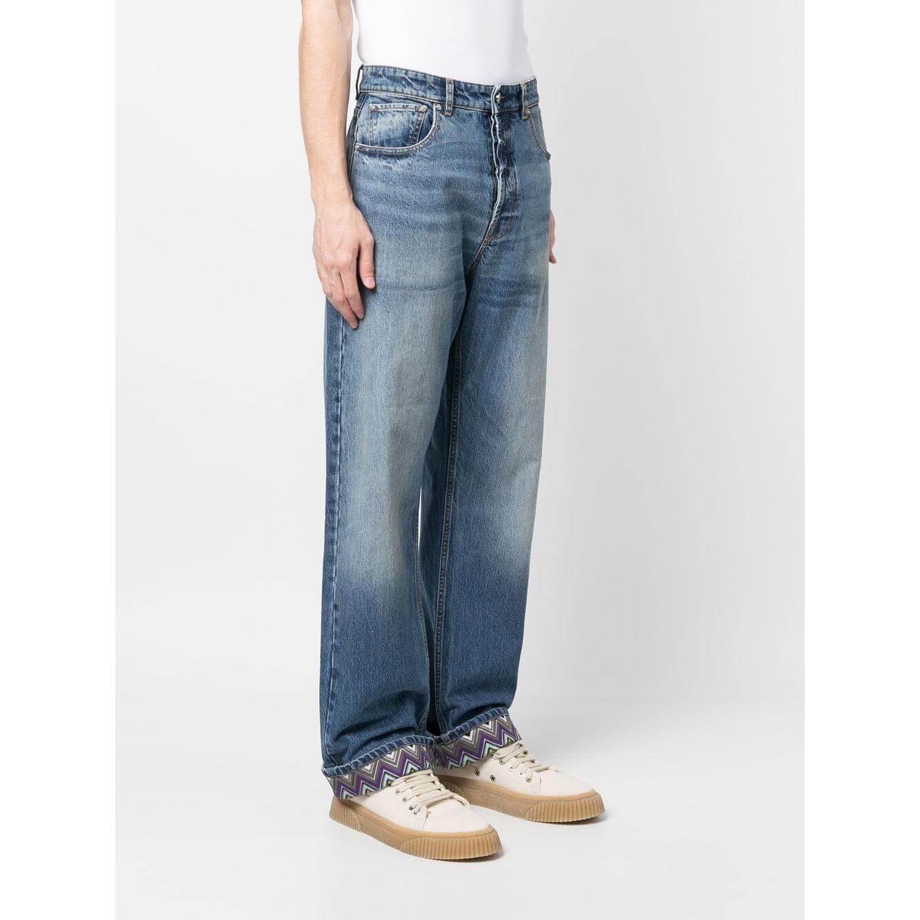 Stonewashed Missoni clear blue jeans with zigzag trim, featuring a straight leg design, button fastening, and classic five-pocket style.