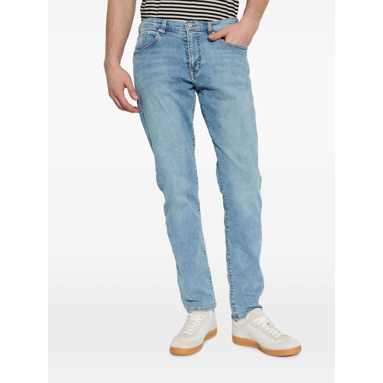 Man wearing PS By Paul Smith Clear Blue Jeans with front button fastening and five pockets.