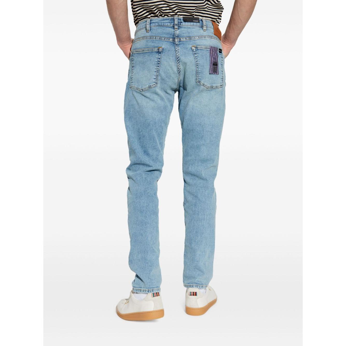 Back view of PS By Paul Smith clear blue tapered denim jeans with belt loops and five pockets, worn by model, true to size fit.