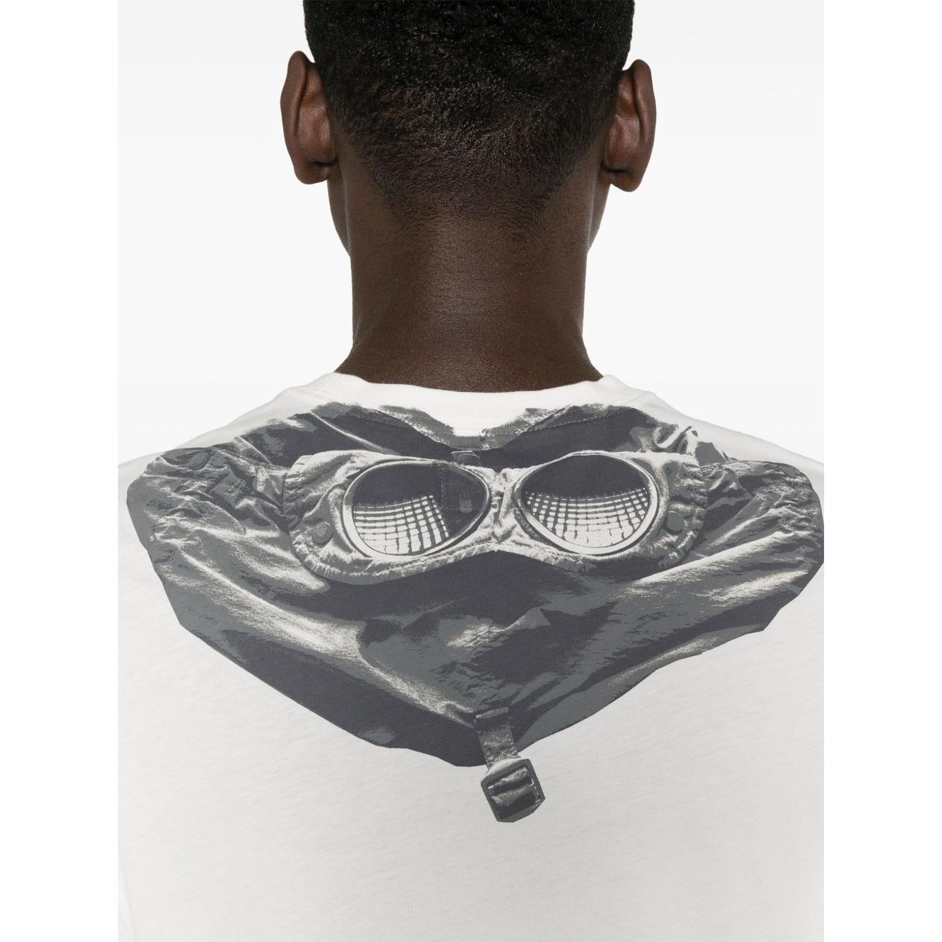 Back view of C.P. Company white t-shirt featuring Goggles print on rear, worn by a male model.