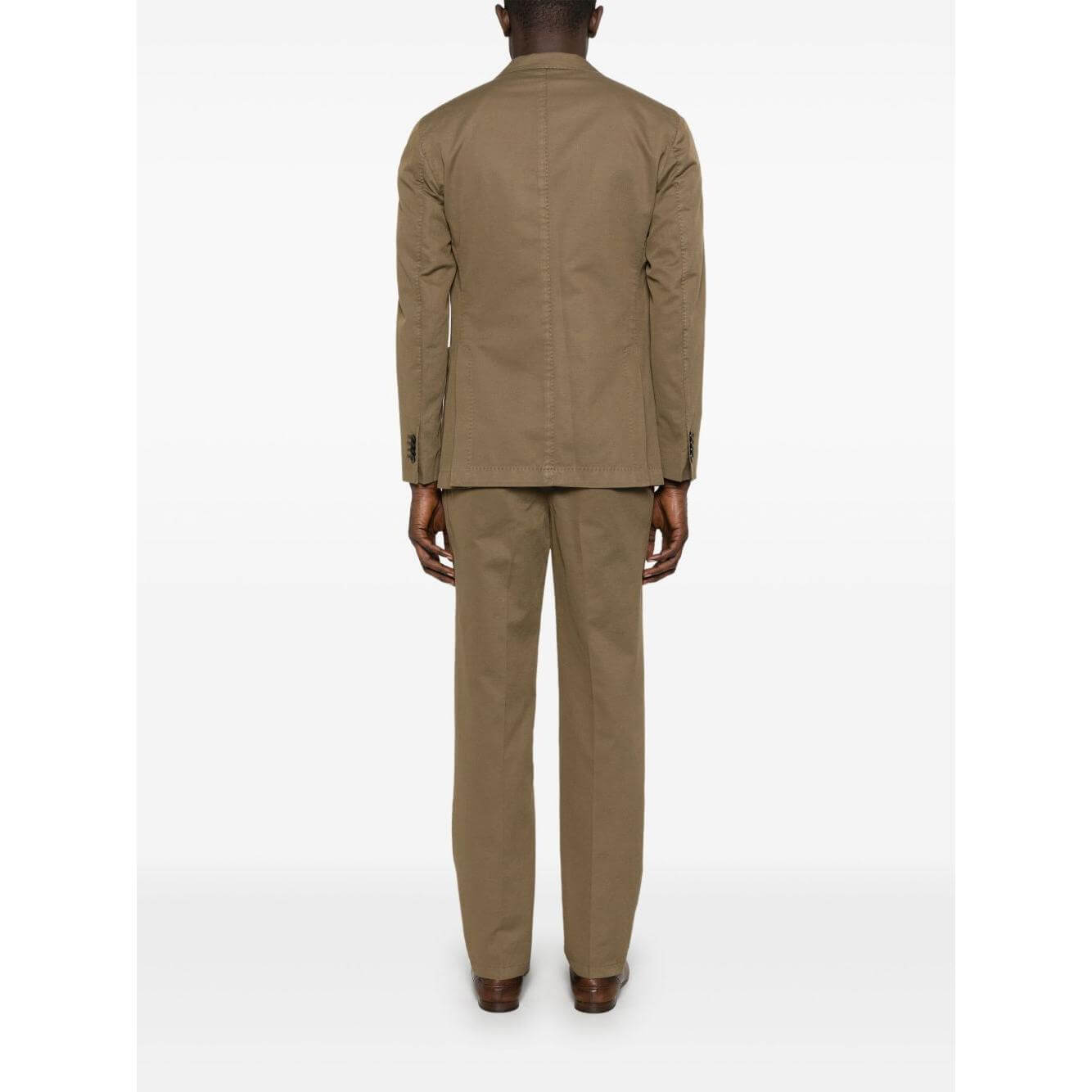 Back view of Boglioli golden brown linen double-breasted suit, featuring welt chest pocket and patch side pockets, worn by male model.