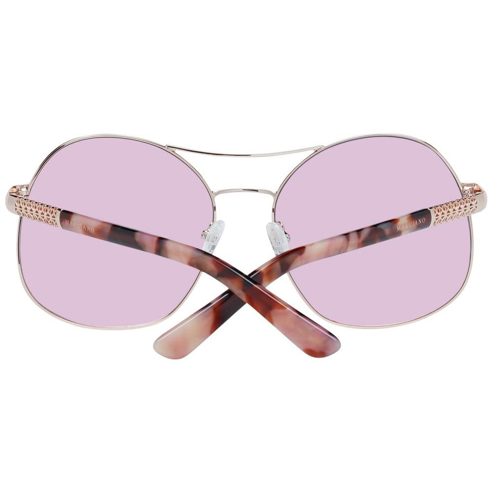 Rose gold Marciano by Guess women's sunglasses with mirrored oval lenses, metal frame, and tortoiseshell temples.