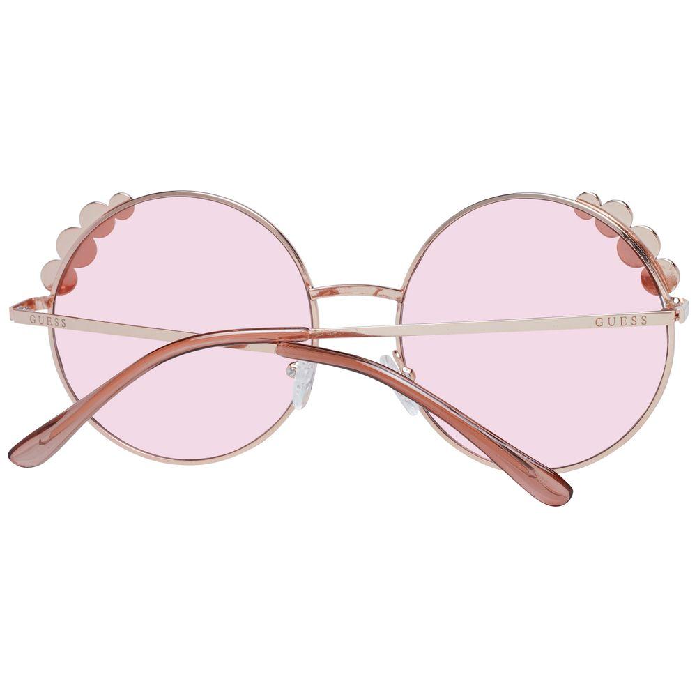 Alt Tag: Guess women’s round rose gold sunglasses with metal frame and pink plastic lenses; full-rim, 100% UVA & UVB protection.