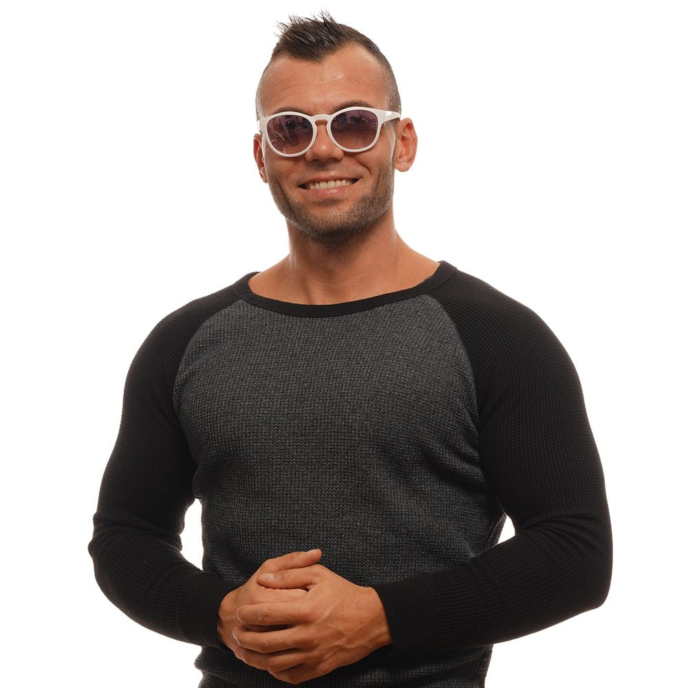 Man wearing Bolle White Unisex Sunglasses with round mirrored blue lenses, full-rim white plastic frame, smiling against a white background.