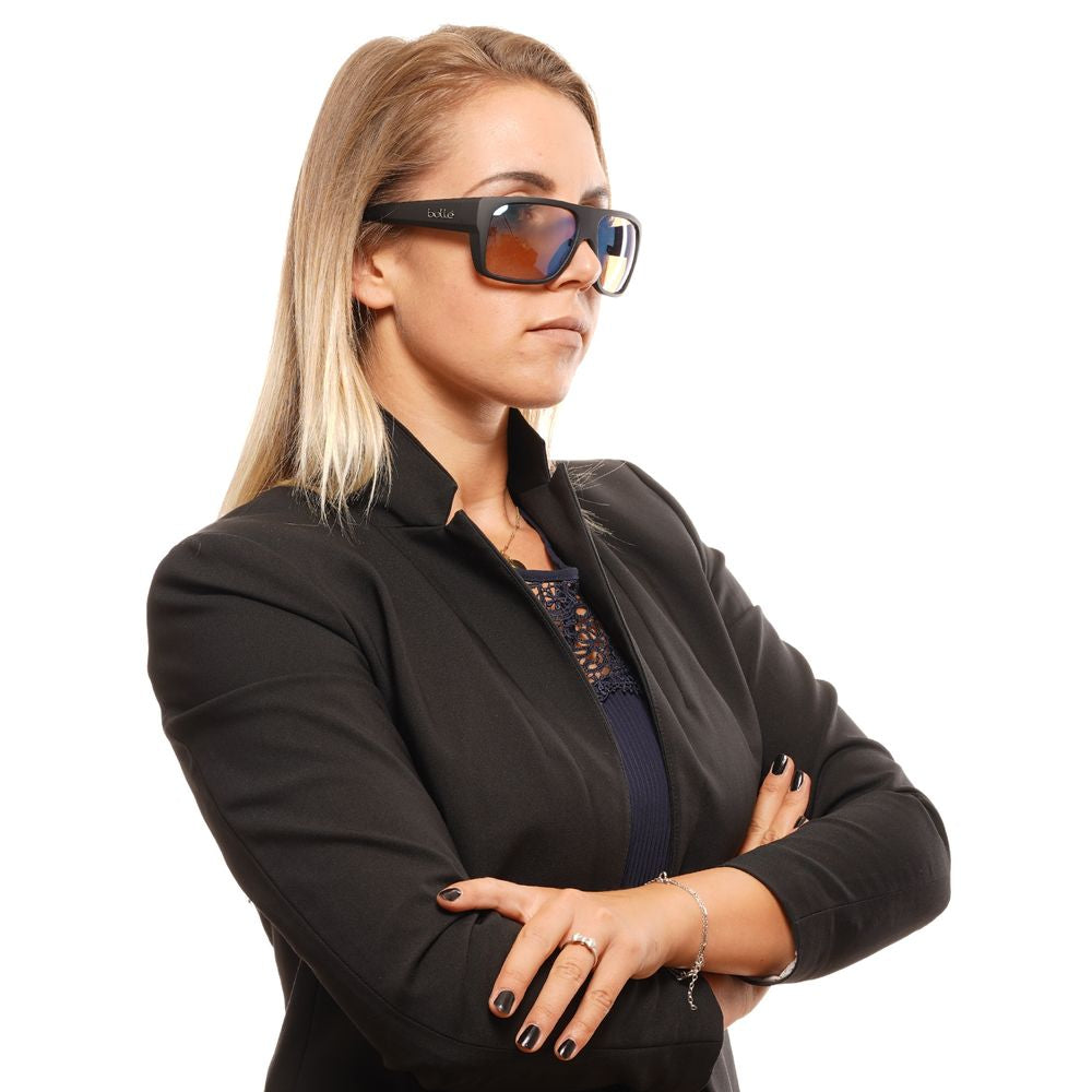 Woman wearing Bolle Black Unisex Sunglasses with brown lenses, crossed arms, in a black blazer.