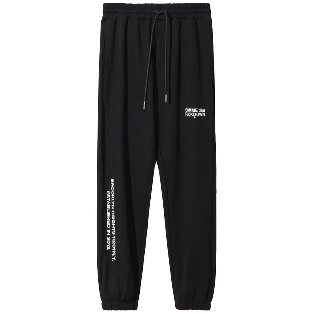 Comme Des Fuckdown black cotton sweatpants with drawstring, logo print on front and sides, featuring side pockets.