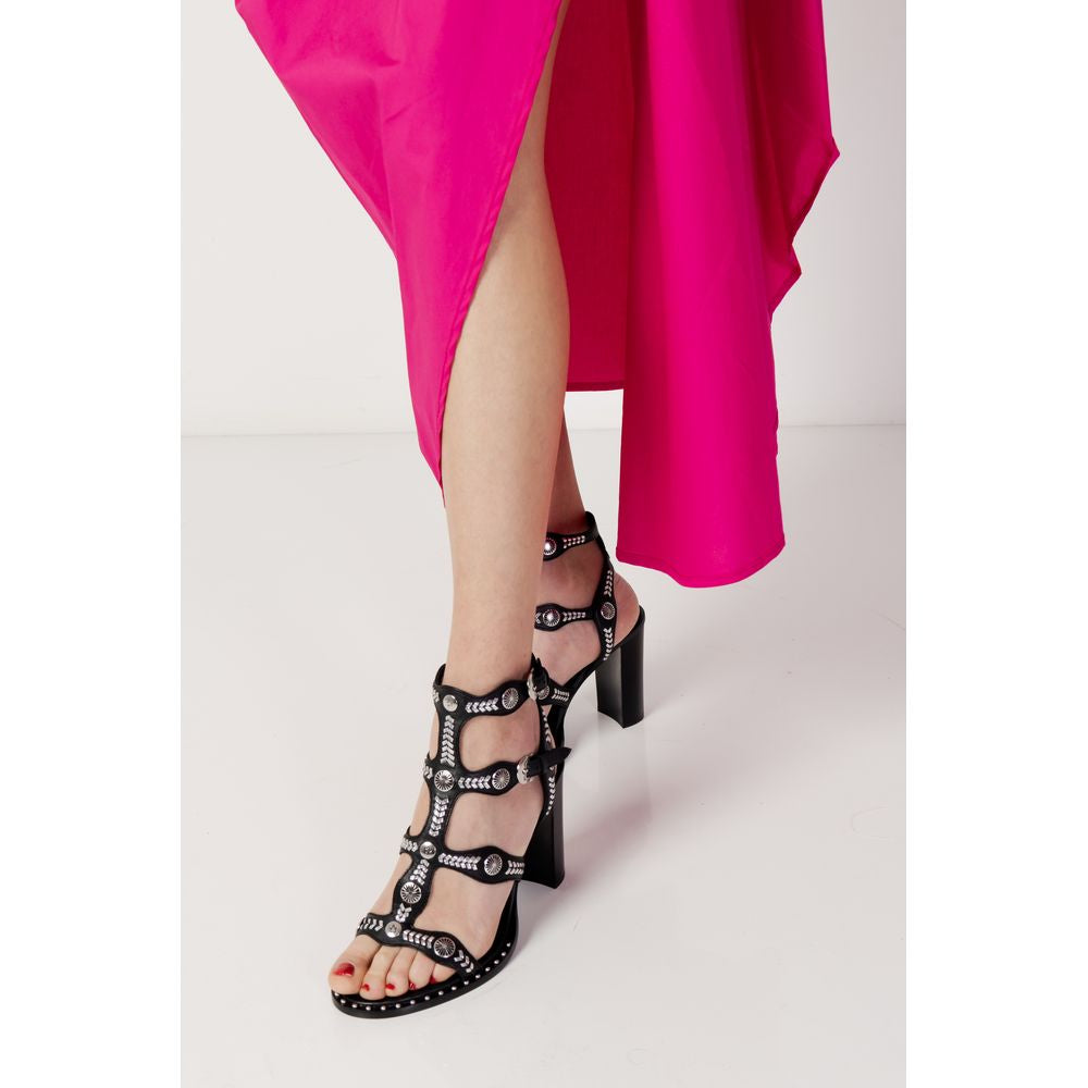 Woman wearing Sandro Ferrone pink cotton dress and black studded high heel sandals, spring summer fashion, elegant style.