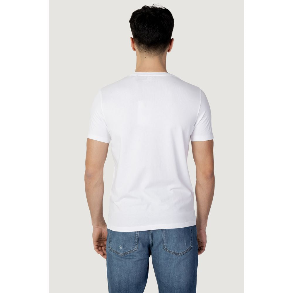 Back view of U.S. Polo Assn. men's white cotton t-shirt, showcasing short sleeves and classic fit, paired with blue jeans for a casual look.