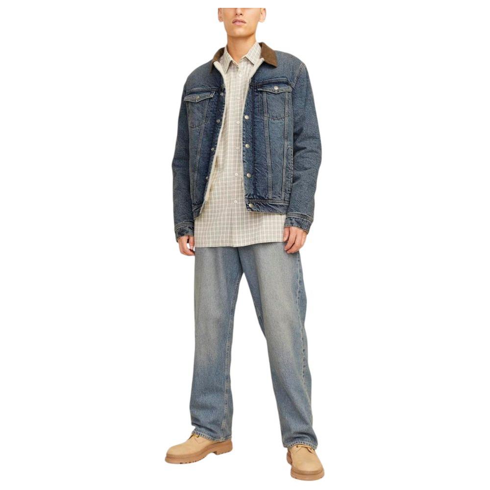 Men's Jack Jones blue cotton jacket for fall/winter collection, worn by model with jeans and boots. Stylish men's outerwear.