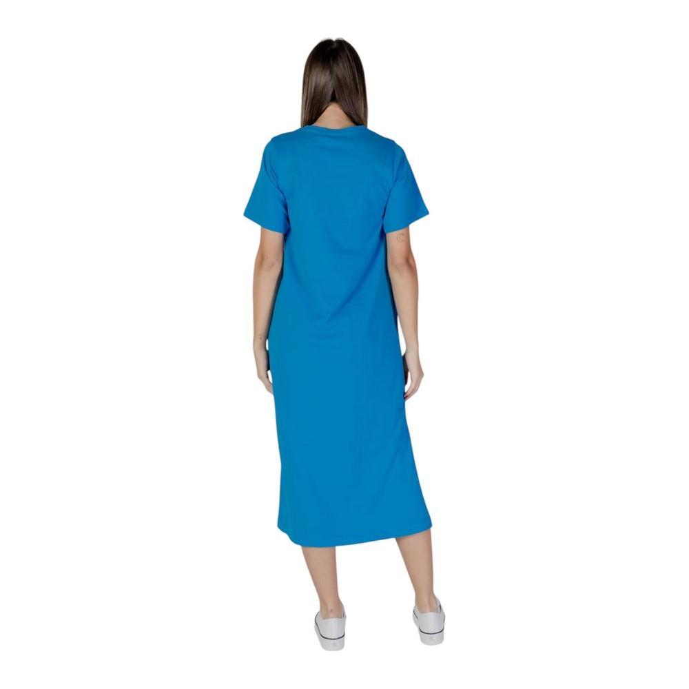 B.Young blue cotton dress, perfect for spring and summer, showcasing back view in vibrant blue, made from 100% cotton.