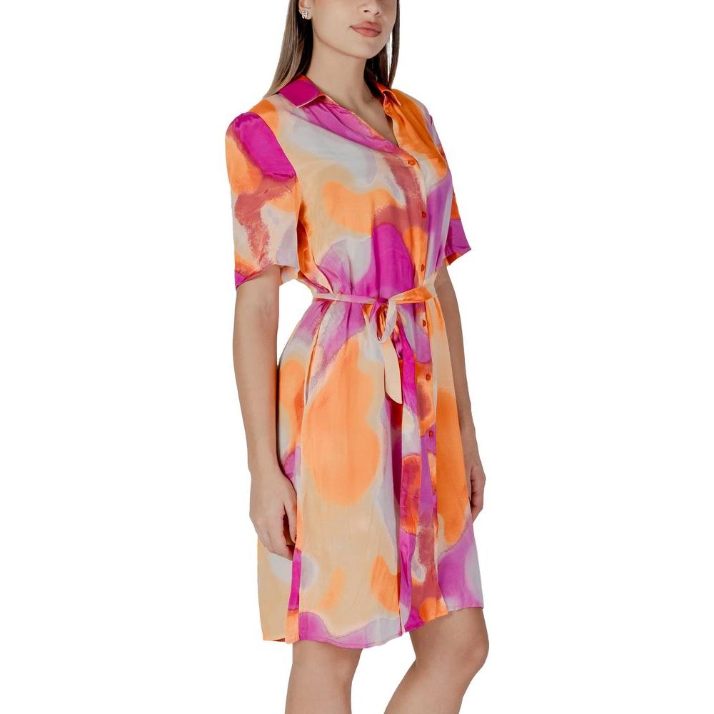 Vibrant orange and pink cotton dress, perfect for spring/summer fashion, featuring a tie-waist and short sleeves.