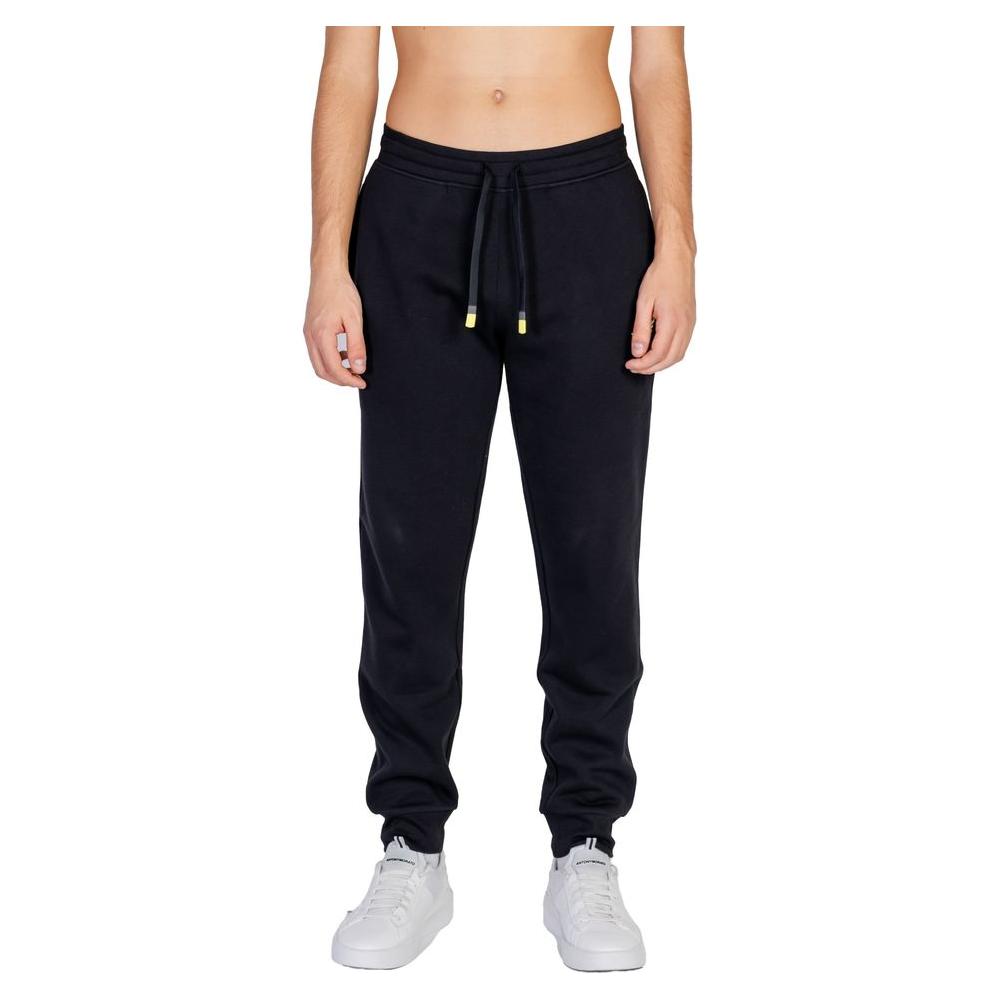 Emporio Armani black cotton sports pants with elastic waistband and drawstring, shown on a model, perfect for sports and leisure.