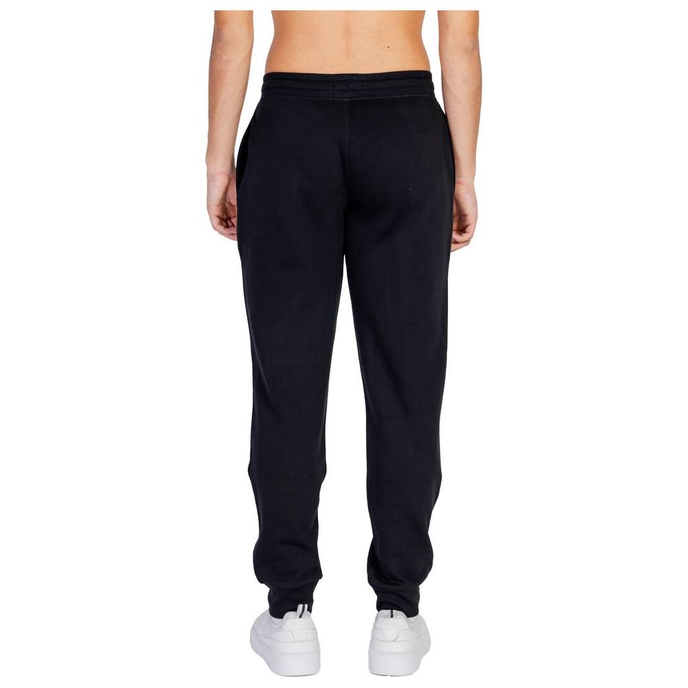 Back view of Emporio Armani black cotton sports pants with elastic waistband and drawstring