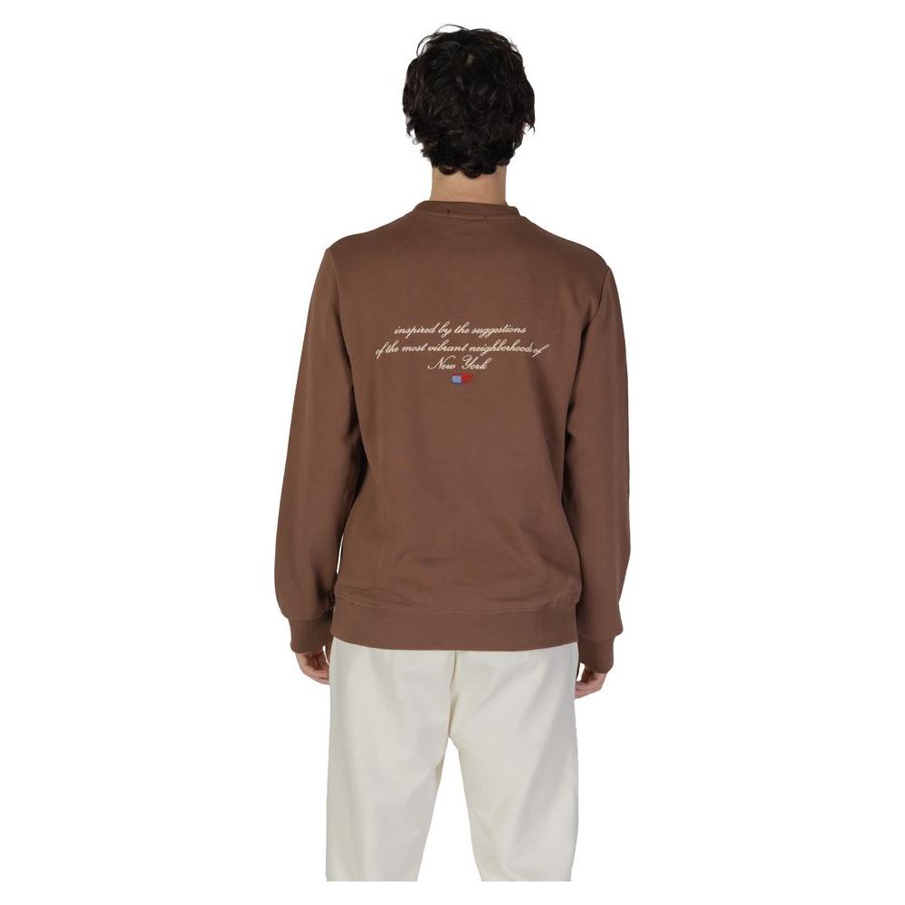 Back view of Underclub brown cotton sweater, men's fall/winter collection, shows white lettering design.