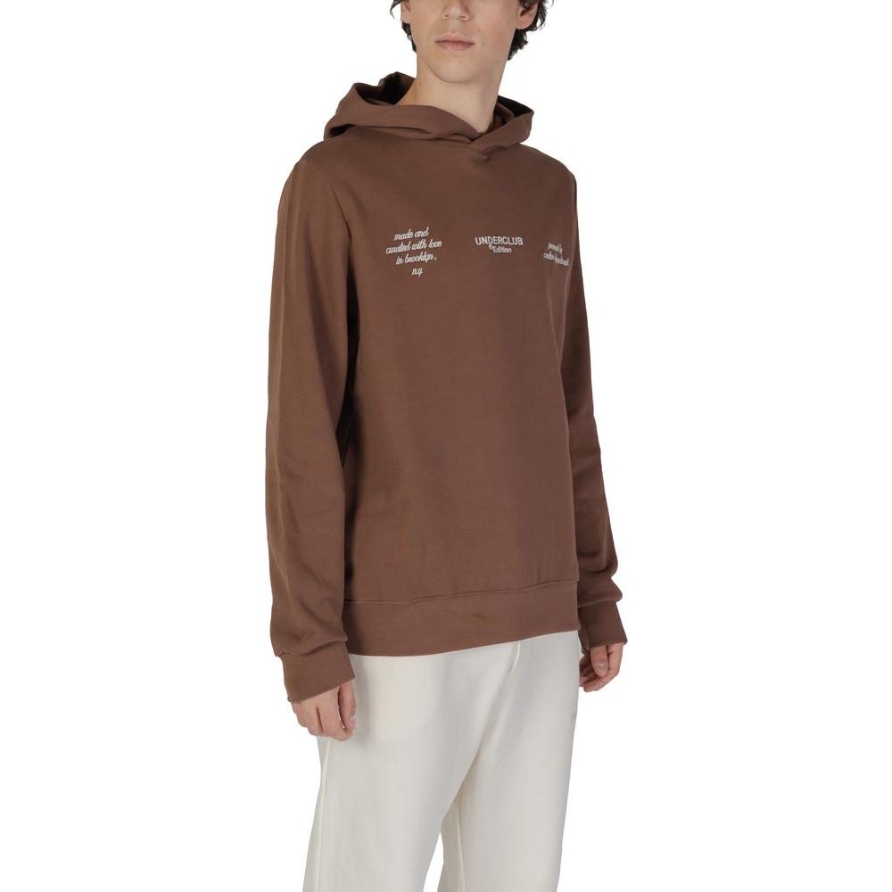 Man wearing Underclub brown cotton sweater from men's fall/winter collection, featuring text detail on chest.