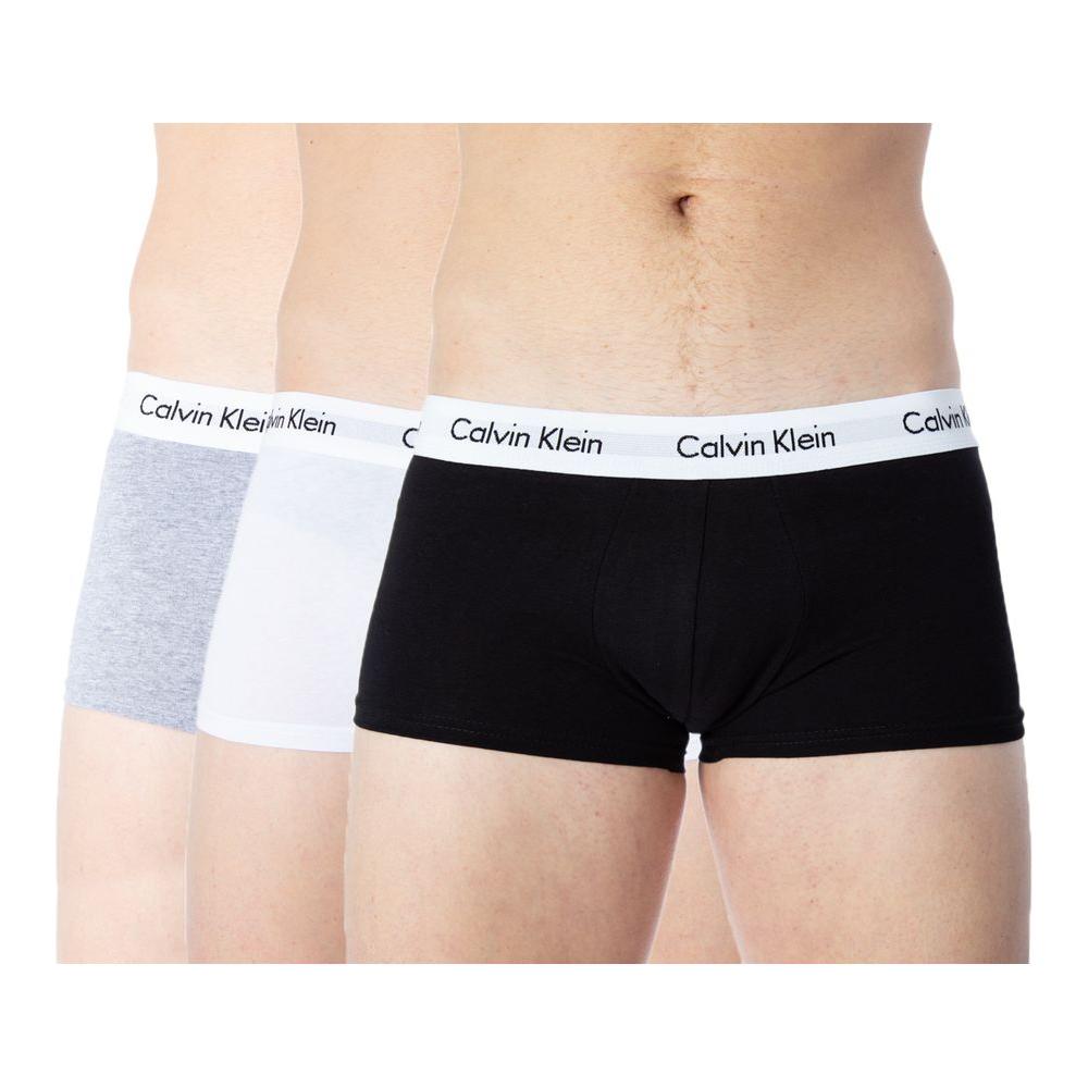 Calvin Klein Underwear 3 Pack Trunks in gray, white, and black with logo waistband, cotton blend for comfort and style.