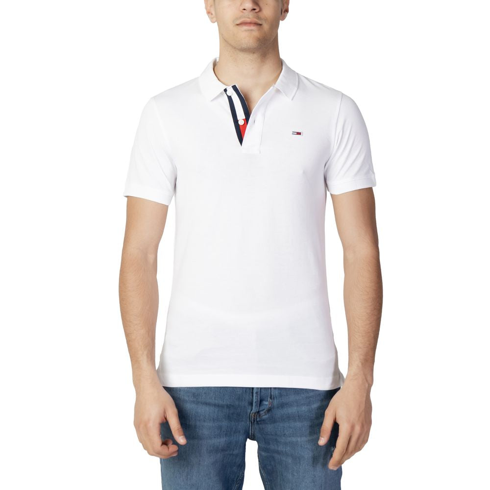 Men's white Tommy Hilfiger cotton polo shirt, fall/winter collection, front view with denim jeans, casual style.