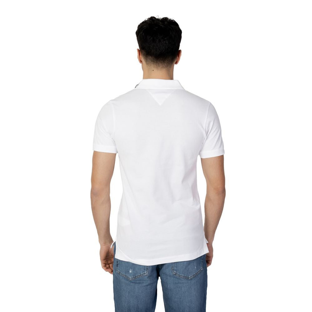Back view of a man wearing a Tommy Hilfiger Jeans white cotton polo shirt, perfect for men's fall/winter collection, 100% cotton.