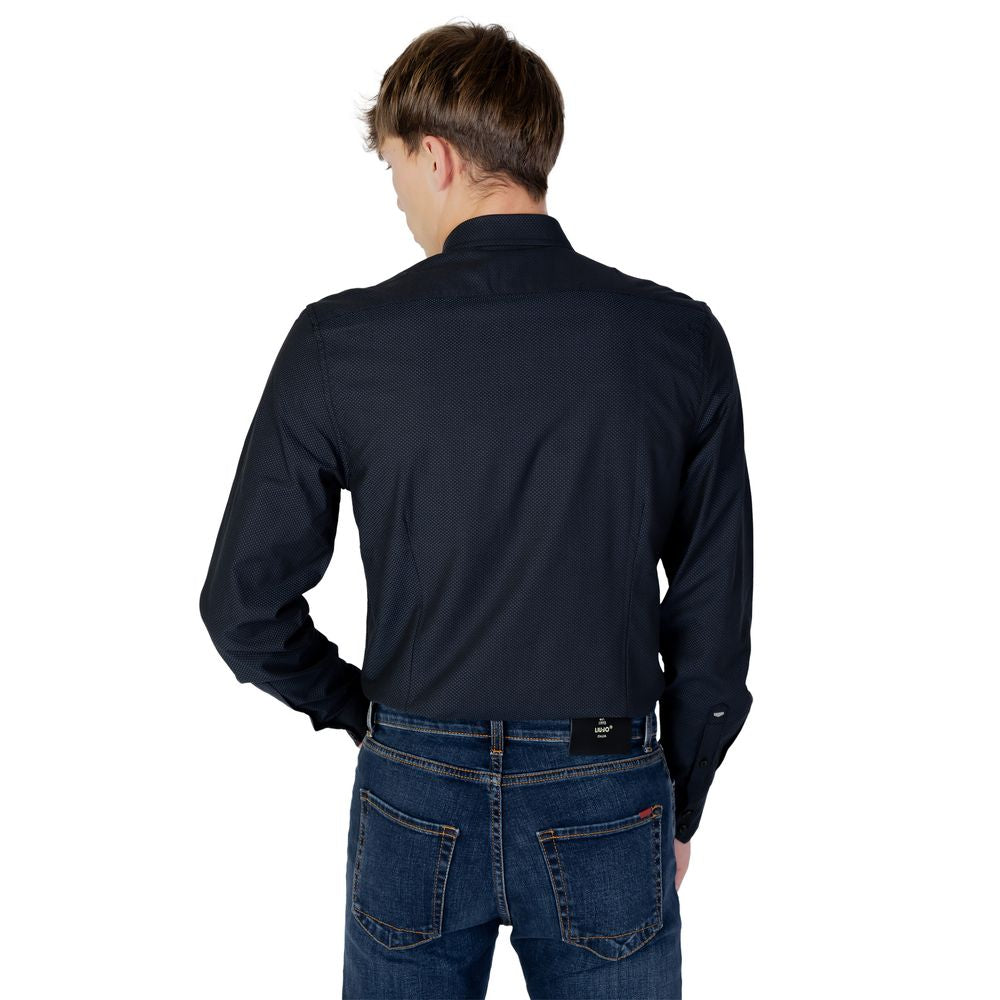 Back view of a man wearing an Antony Morato blue cotton long sleeve shirt from the Autumn/Winter collection, paired with jeans.