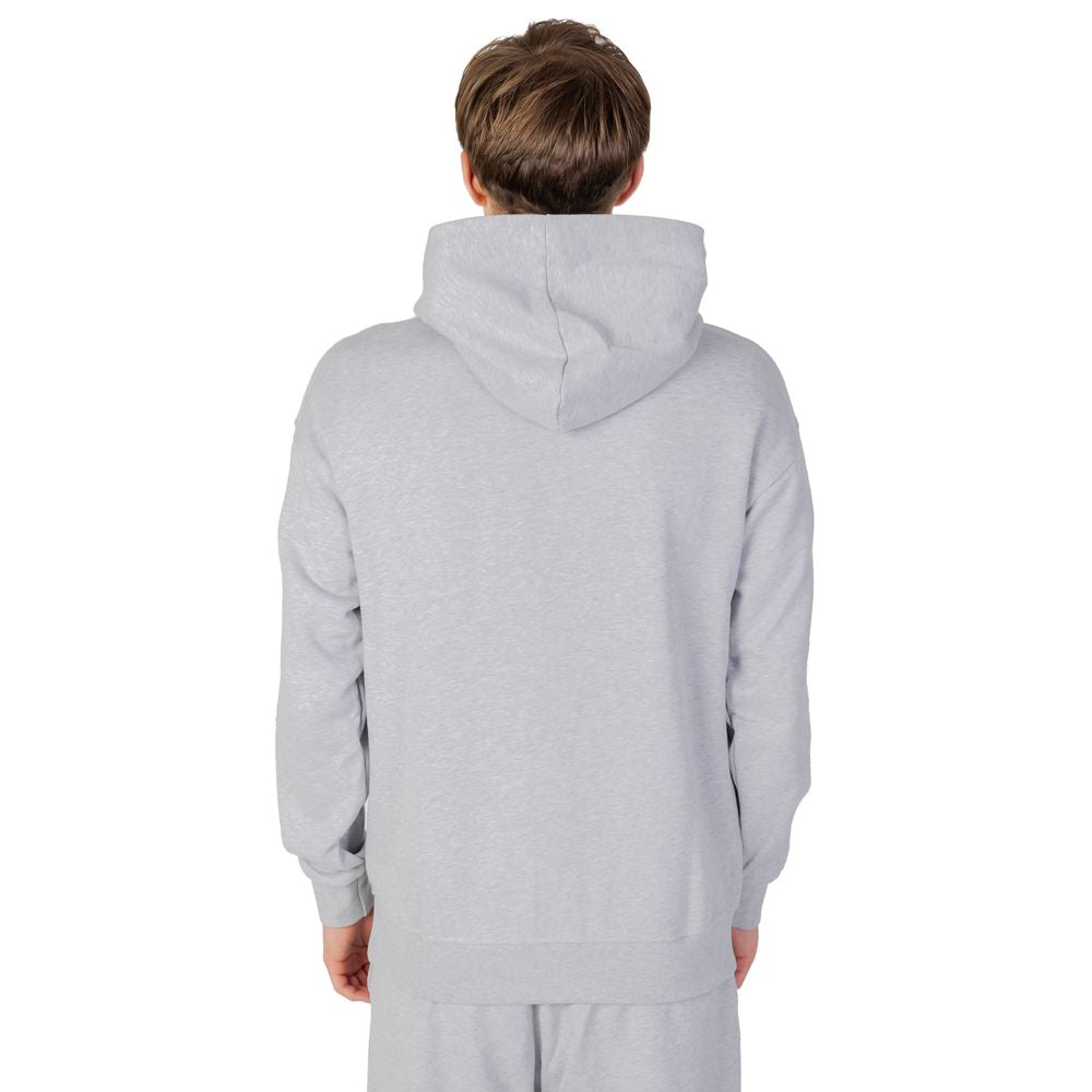 Man wearing Underclub gray cotton hooded sweatshirt, back view, part of the autumn/winter collection, 100% cotton composition.