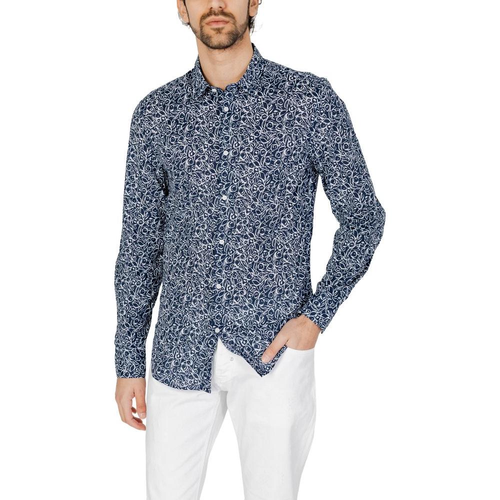 Antony Morato blue long sleeve cotton shirt for men, spring/summer collection, featuring a geometric pattern, styled with white pants.