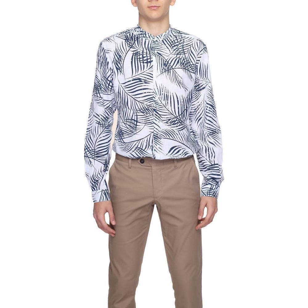 Men's long sleeve printed shirt with leaf pattern, paired with tan trousers.
