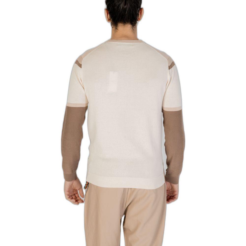 Back view of a person wearing a beige and brown long-sleeve shirt and pants, showcasing the design and fit from the rear.