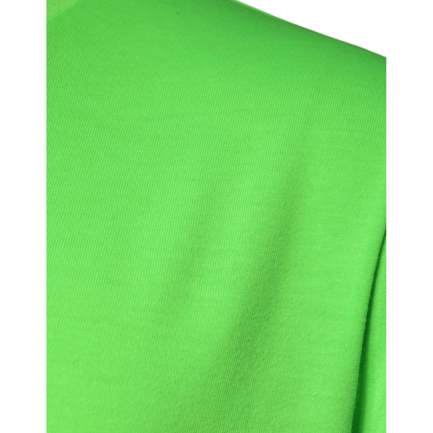 Close-up of Dolce & Gabbana green t-shirt fabric texture and color detail.