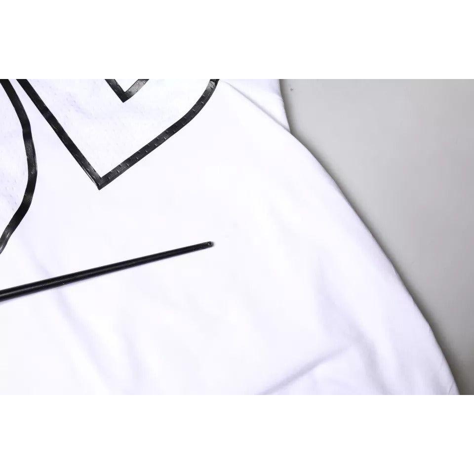 Close-up of Dolce & Gabbana white crew neck T-shirt with black logo, showing minor stain on the front fabric.
