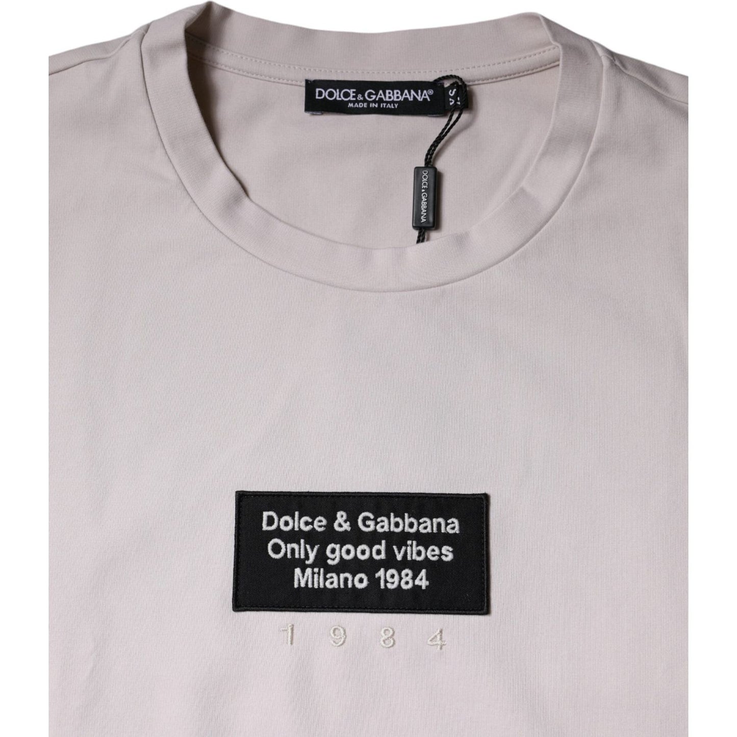 Dolce & Gabbana beige cotton blend crew neck T-shirt with logo patch and graphic print, short sleeves, small front stain, missing tag
