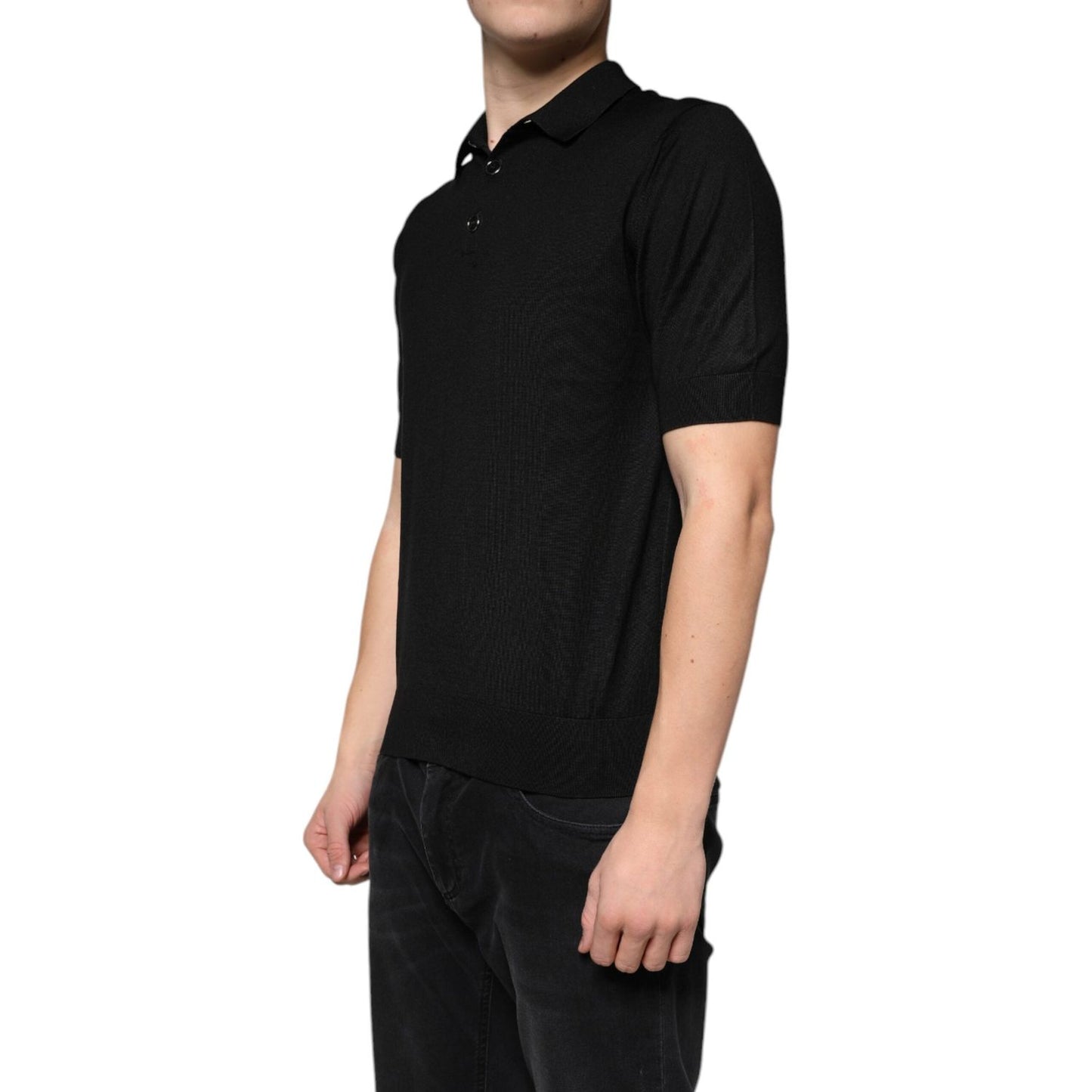Dolce & Gabbana black silk polo T-shirt with short sleeves, collared neck, button closure, worn by model, made in Italy, regular fit.