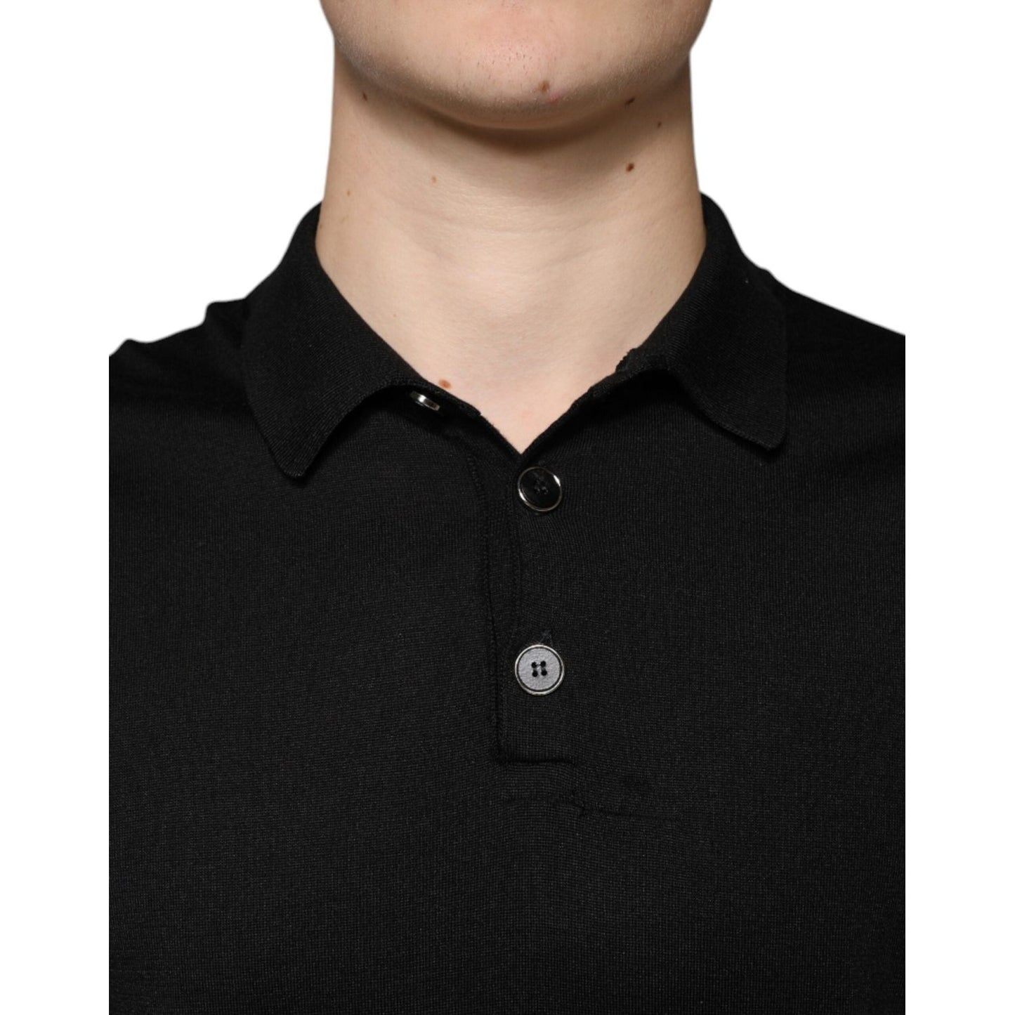 Dolce & Gabbana men's black silk polo shirt with short sleeves and button closure, minor thread defect visible on front.