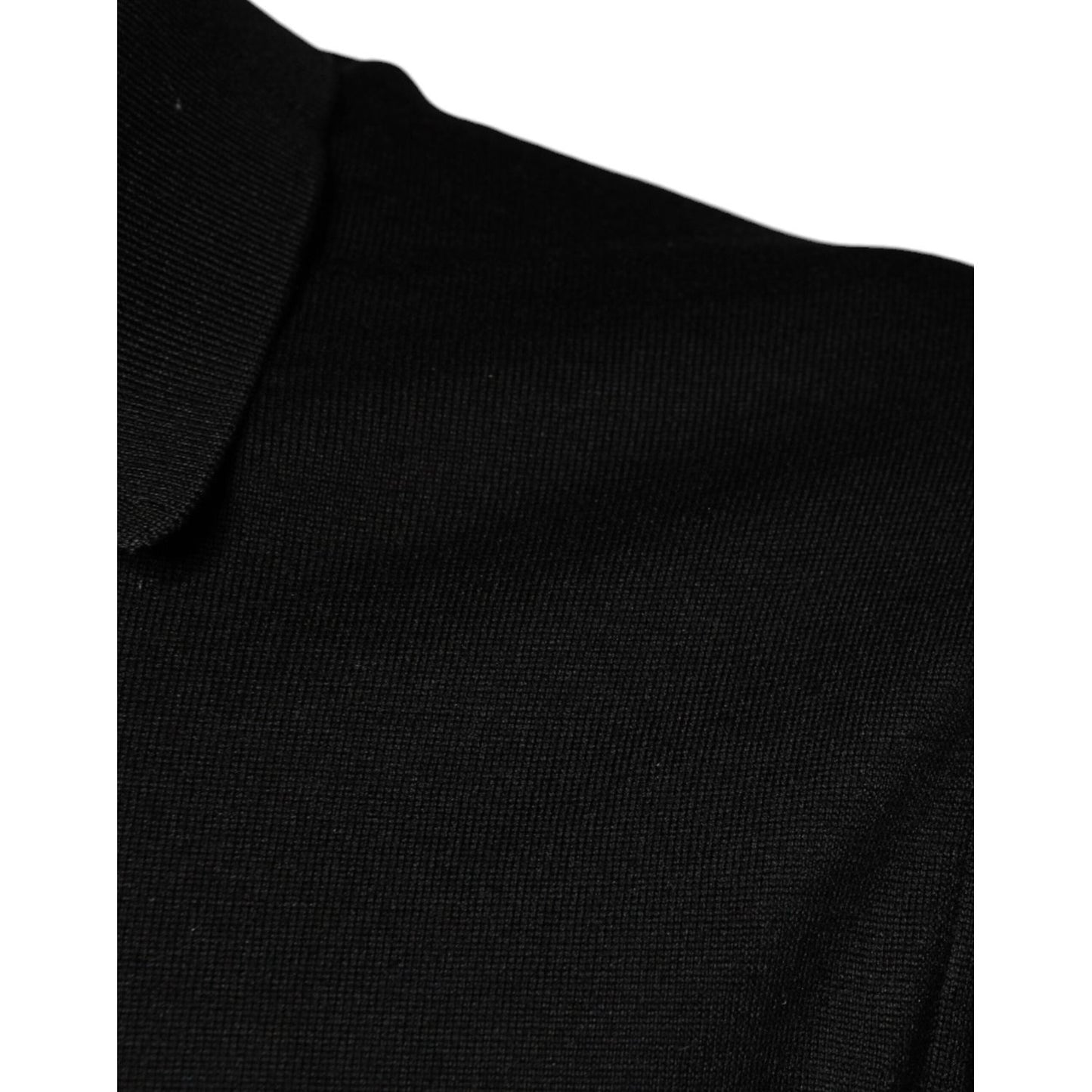 Dolce & Gabbana black silk polo shirt close-up showing collar and fabric texture.