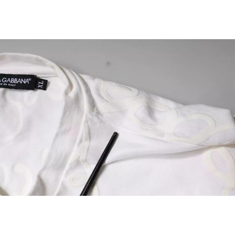 Close-up of Dolce & Gabbana white cotton t-shirt with logo print, featuring pen marks and stains on front, regular fit crew neck.