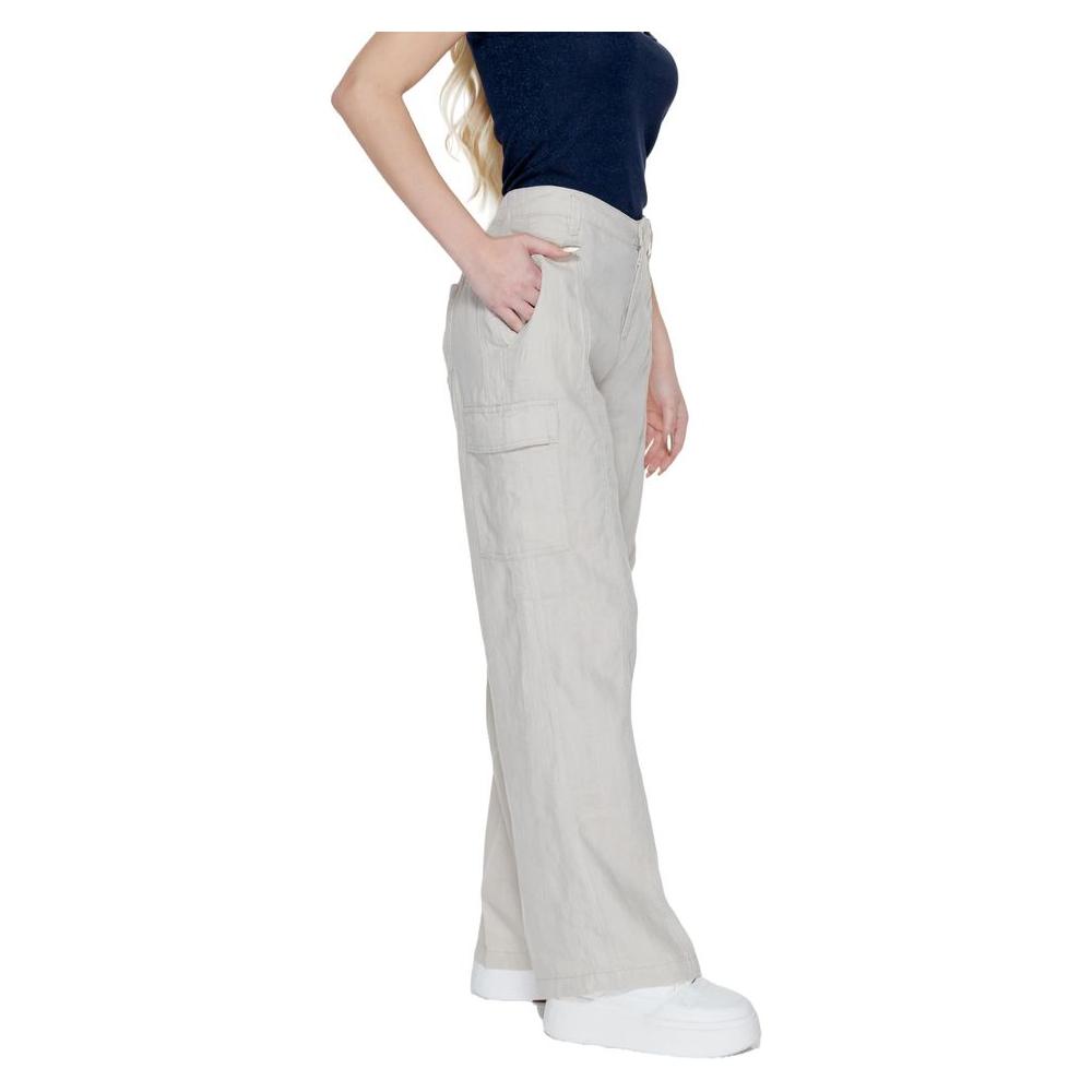 Alt Tag: Woman wearing Street One beige linen bootcut pants suitable for spring and summer collection, featuring 100% linen fabric.