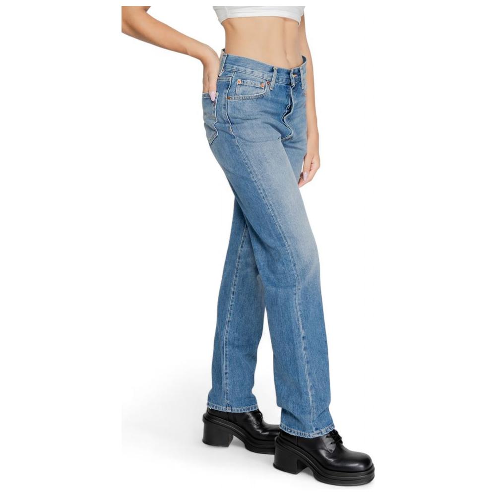 Model wearing Replay blue cotton jeans and pants for women, fall/winter collection, showcasing 100% cotton composition, side view.