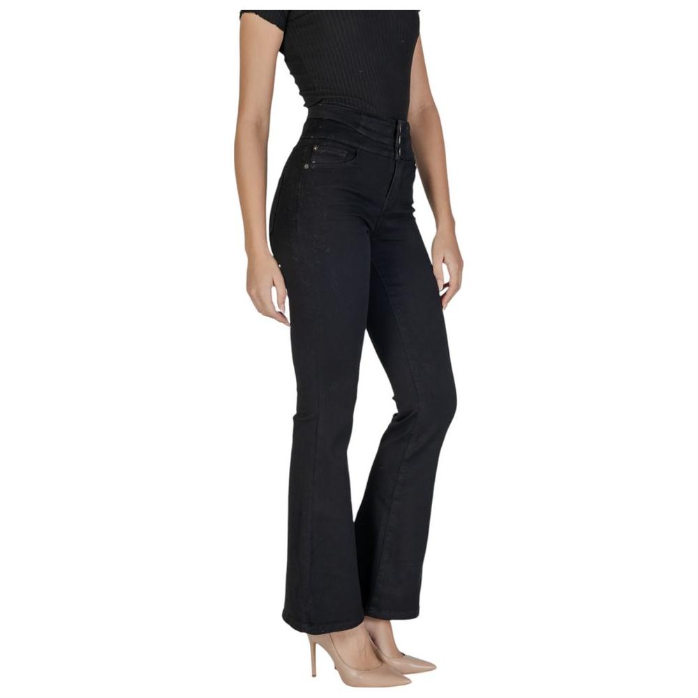 Women's fall/winter black cotton jeans and pants, high waist, eco-friendly fabric, front view.