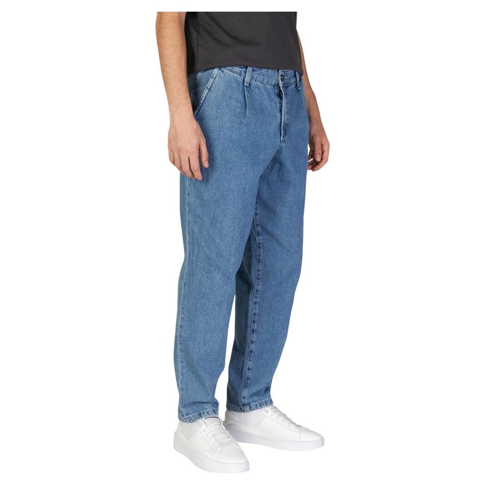 Men wearing Jack Jones blue cotton jeans, regular loose fit, part of fall/winter collection, featuring 95% cotton and 5% recycled materials