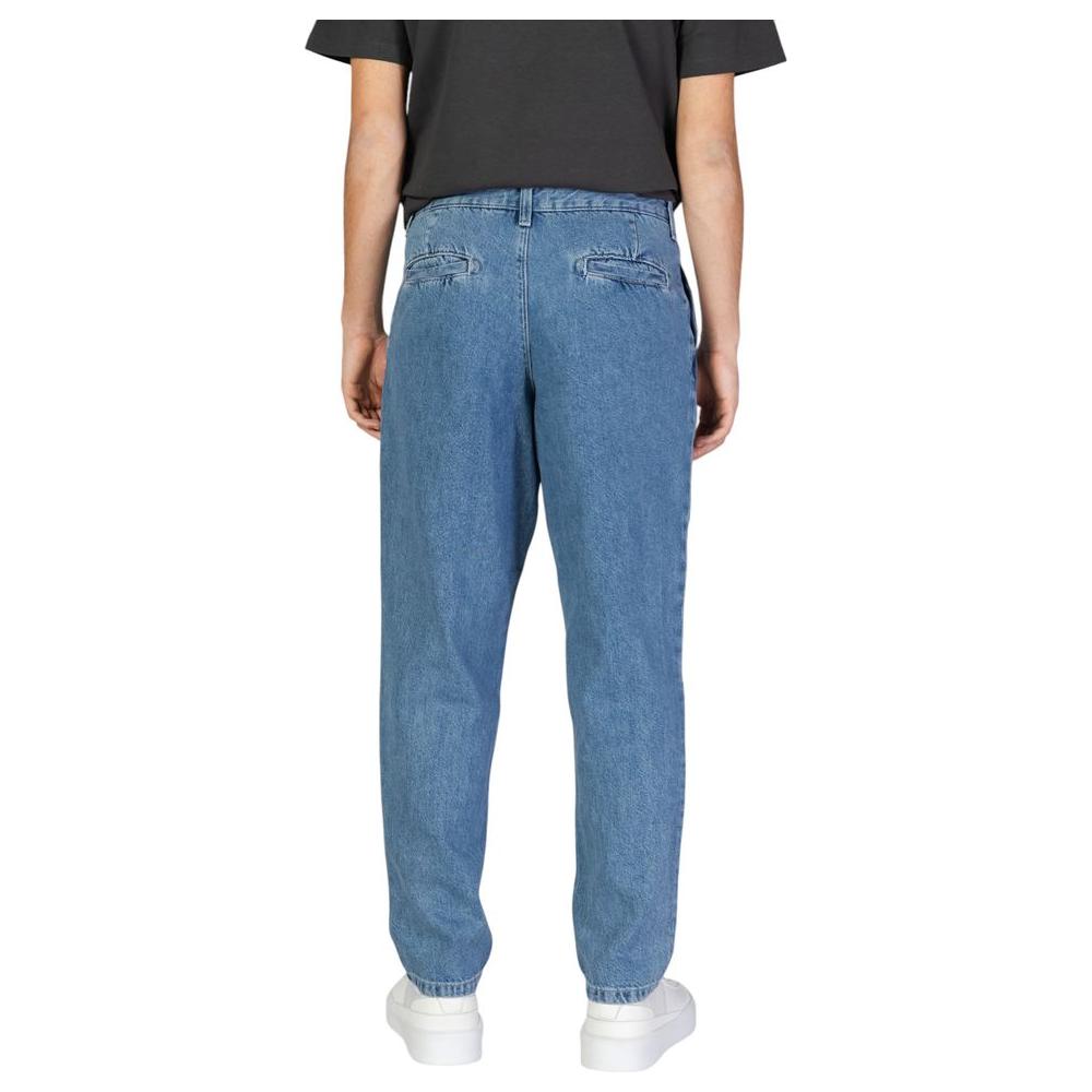 Back view of Jack Jones blue cotton jeans, featuring a regular fit, ideal for men's fall/winter fashion. Made of 95% cotton.