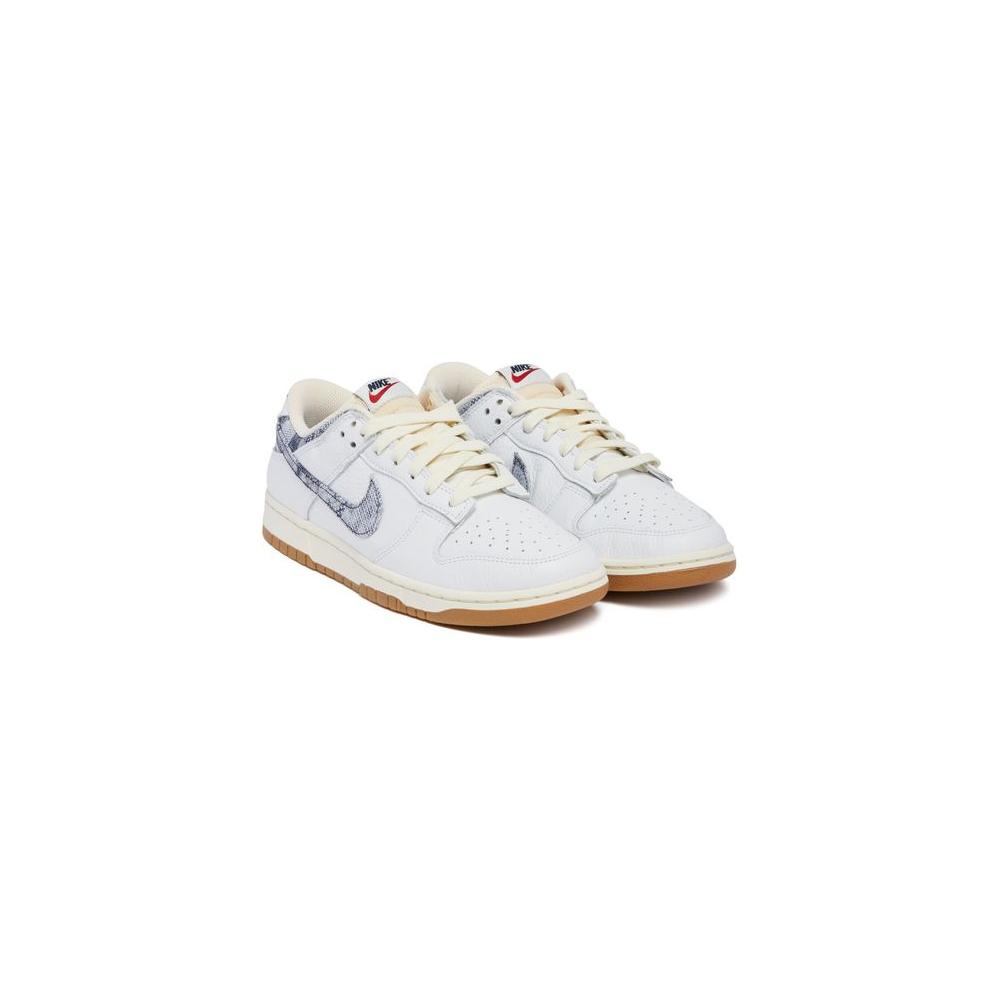 White Nike sneakers with a blue pattern, featuring a brown sole and white laces, perfect for casual wear.