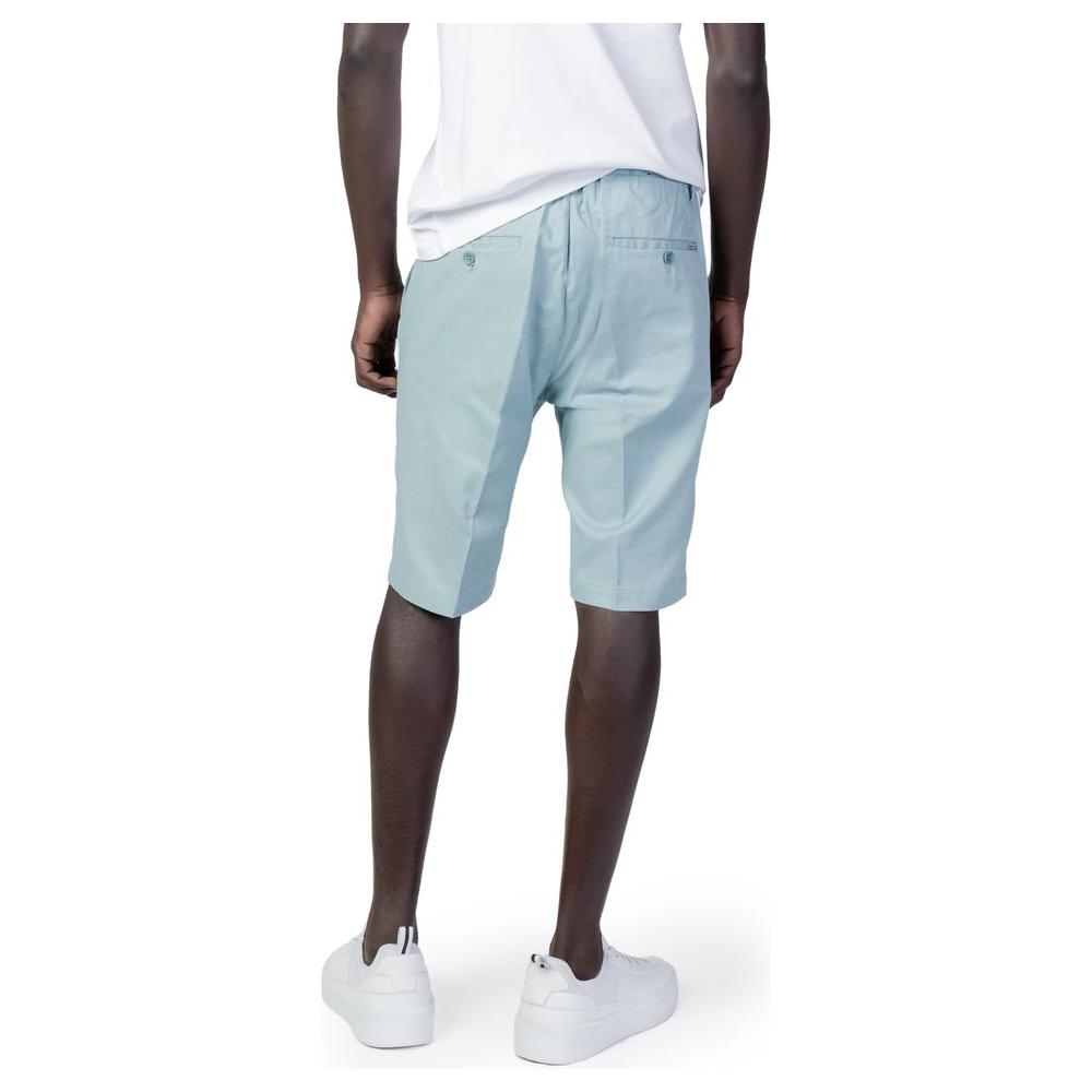 Man wearing Antony Morato green cotton shorts, spring/summer collection; 98% cotton, 2% elastane for comfort and style.
