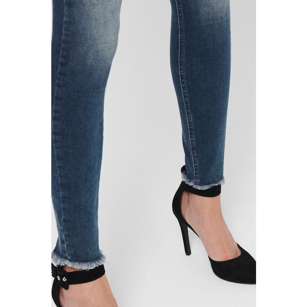Close-up of Only blue skinny jeans for women, made from cotton and elastane, paired with black high heels.