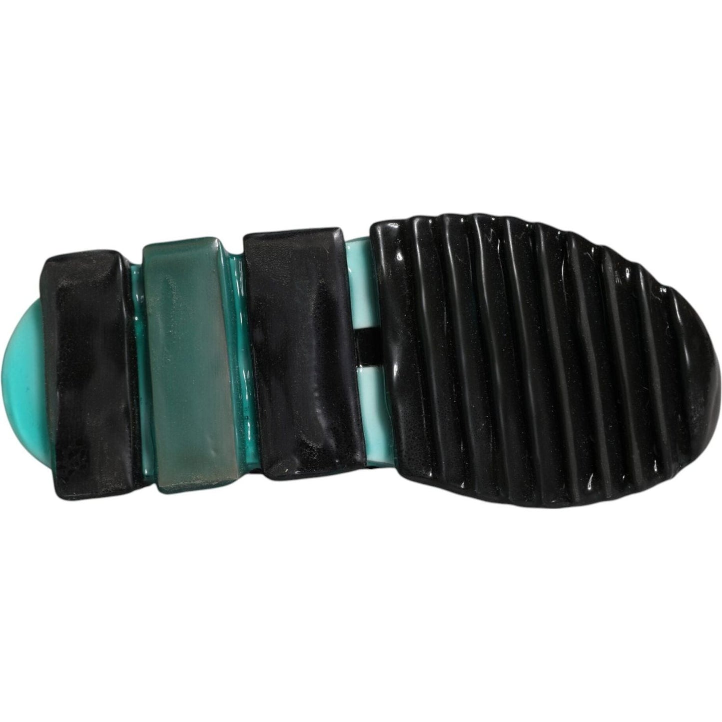 Bottom view of Dolce & Gabbana Sorrento sneaker showing grooved black and turquoise rubber sole.