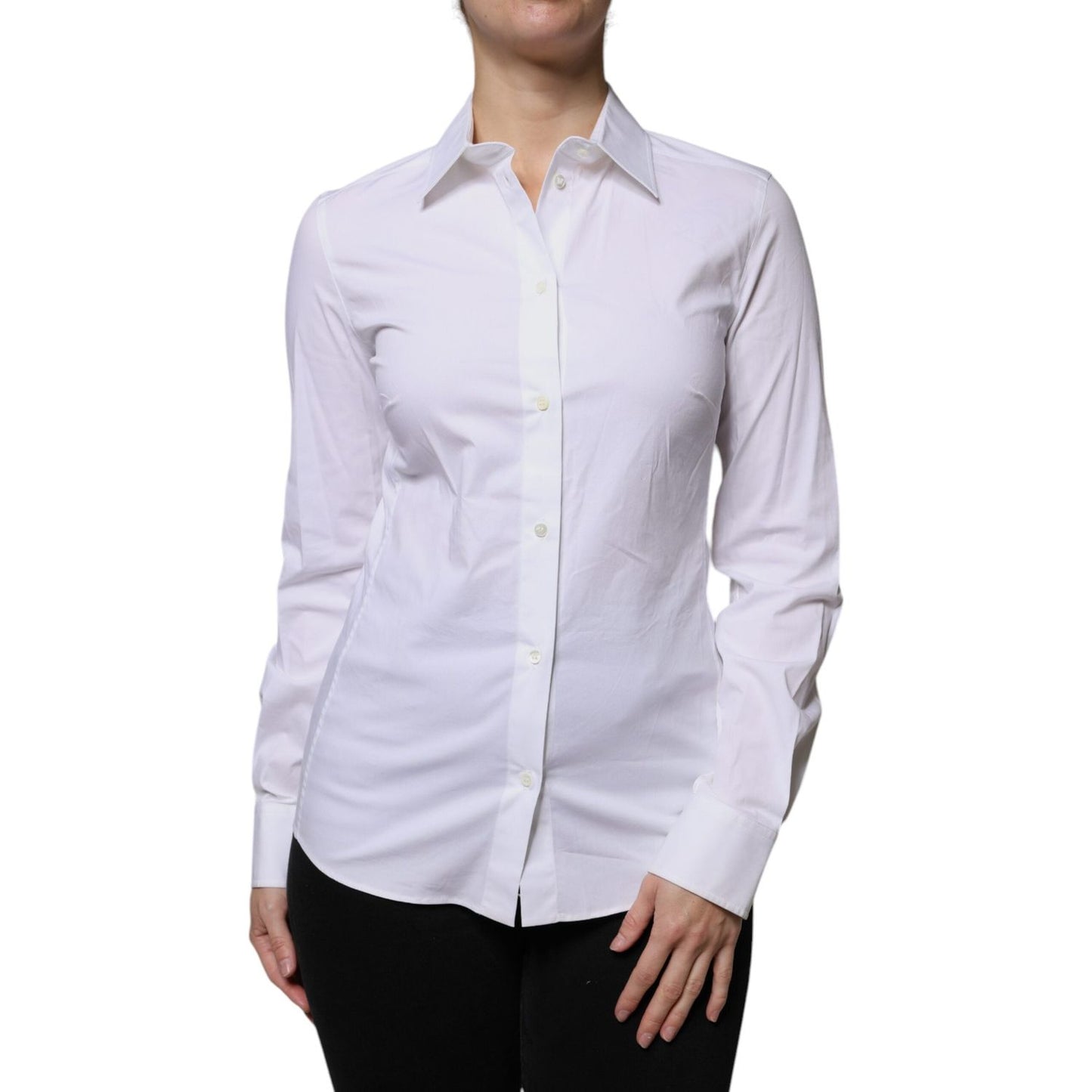 Dolce & Gabbana white collared long sleeve cotton shirt with button closure, worn by model, showcasing elegant fashion.