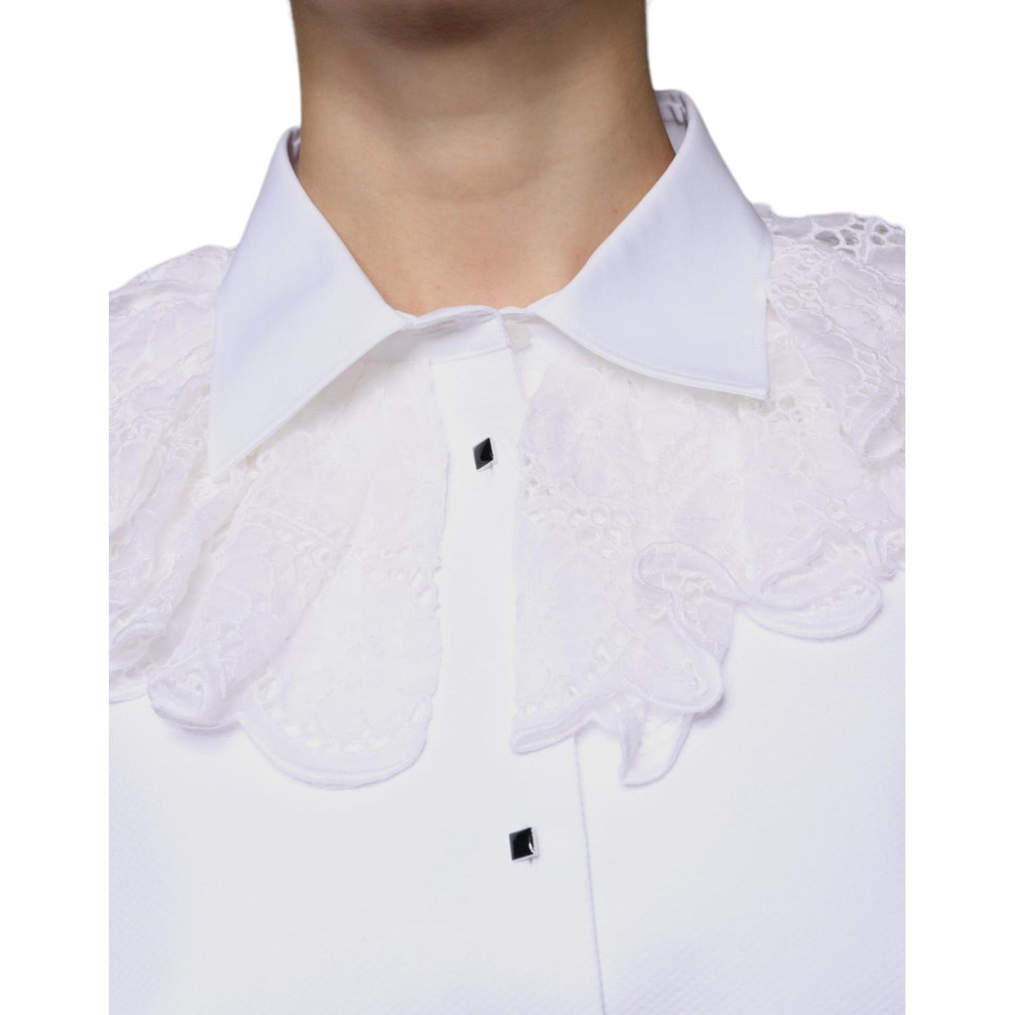 Close-up of Dolce & Gabbana white cotton poplin shirt dress blouse with lace details and button front, shown on model.