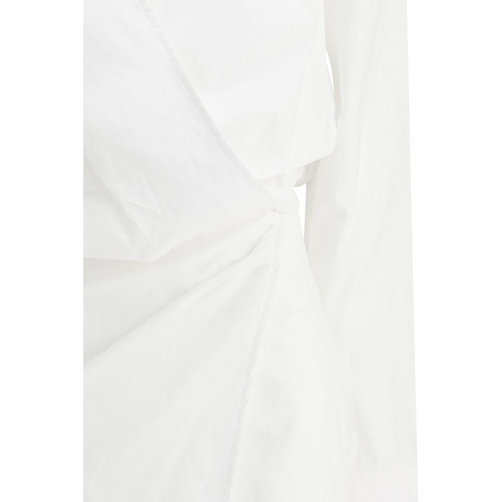 Close-up of The Attico Chemisier Dress showcasing wrap skirt design, monochrome cotton fabric, and iconic logo stitching. Fashion elegance.