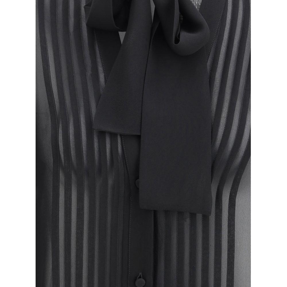 Close-up of Tom Ford silk georgette shirt showcasing sheer texture with V-neckline and monochrome pattern.