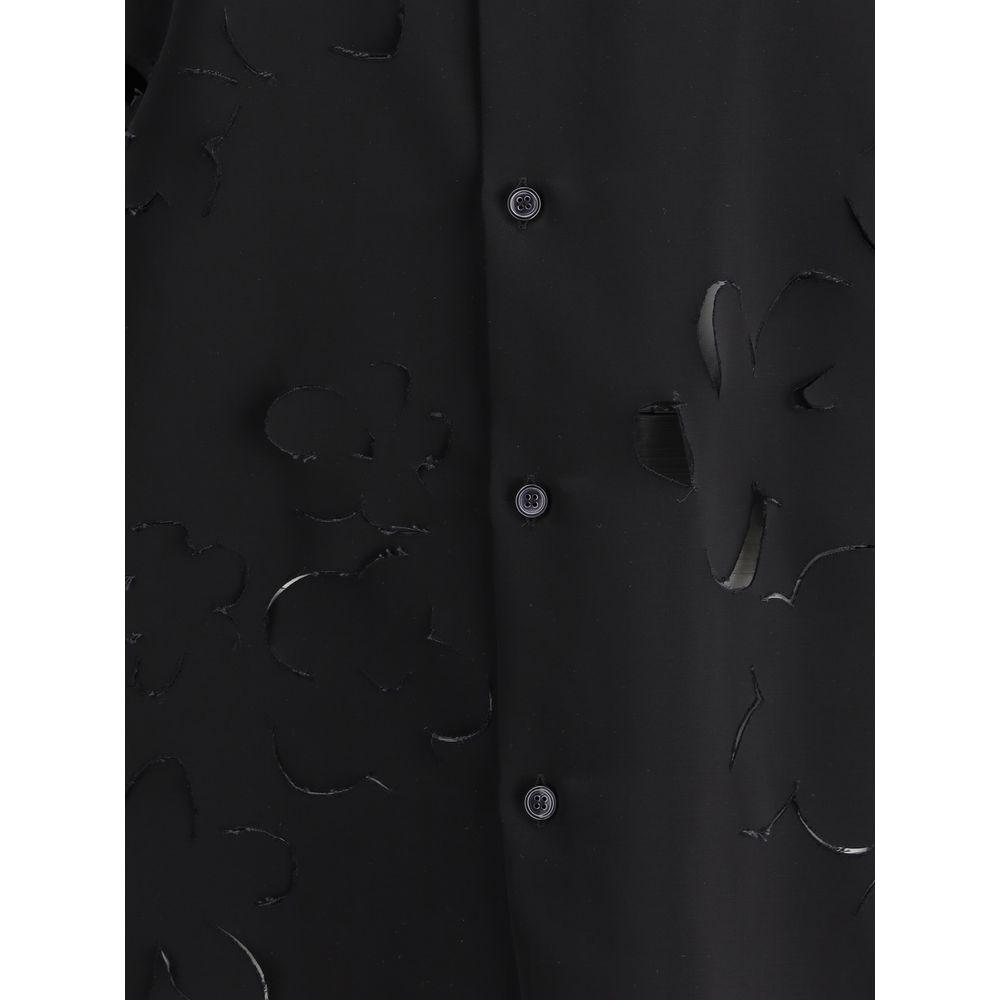 Close-up of Marni shirt with classic collar, button front, and monochrome flower cut-out details.